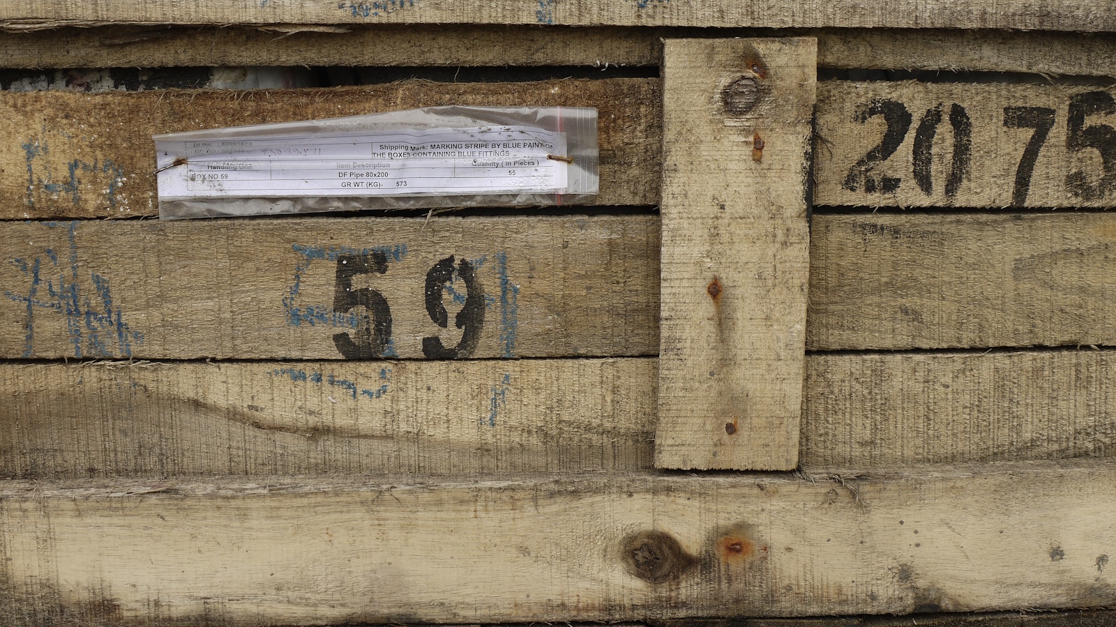 a close up of a piece of wood with numbers on it